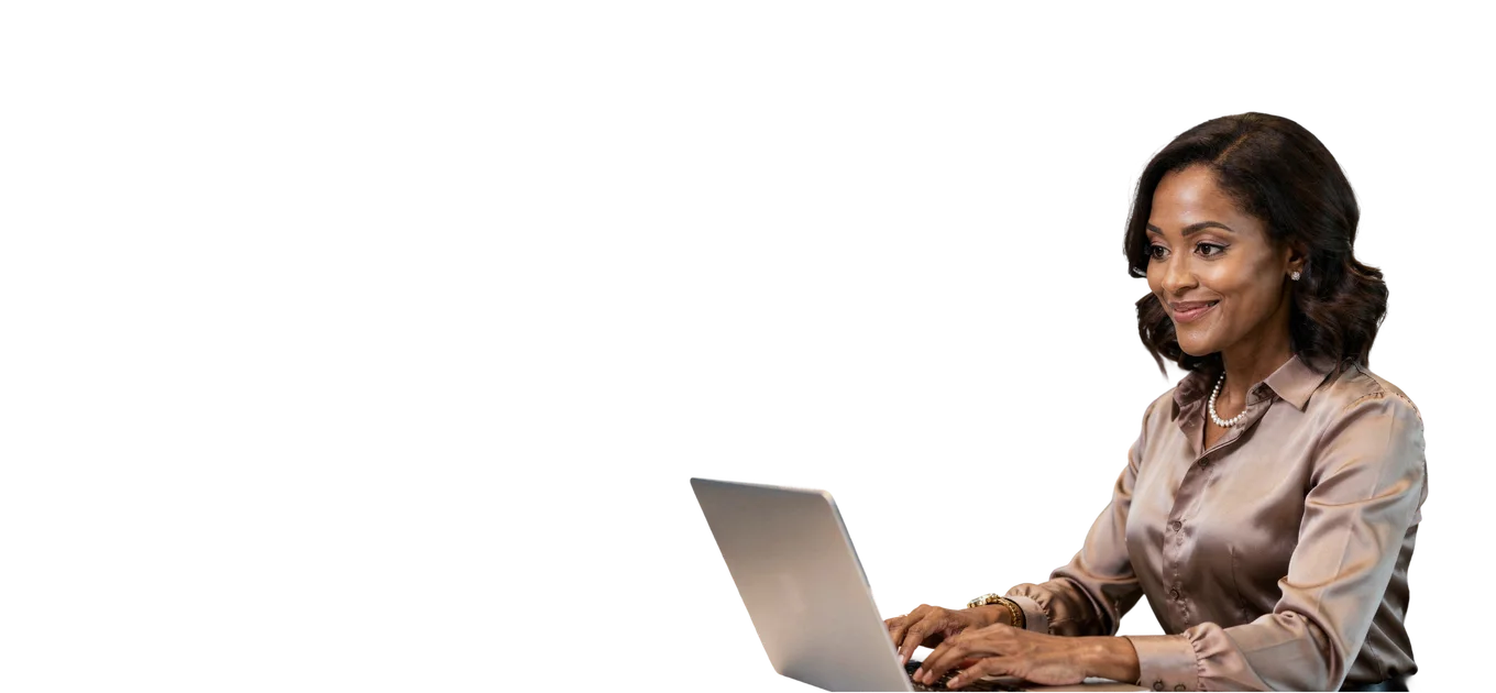 Woman in a satin blouse working on a laptop